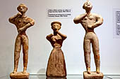 Museo archeologico di Iraklion. Clay female and male figurines in an attitude of worship. Chamezi, 1900-1700 BC. 